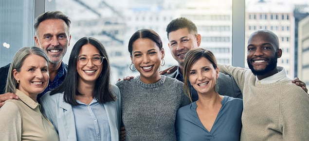 Smiling Employees in Blue and Neutral Clothing_980x450